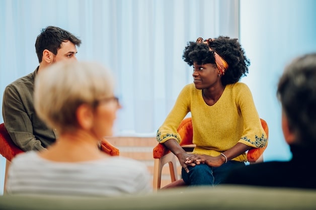 group therapy appointment, patients talking to eachother.
