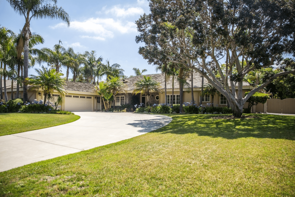 A serene residential treatment facility surrounded by palm trees.
